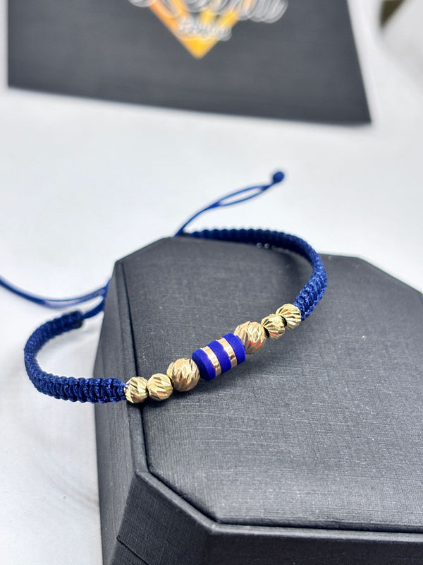 PULSERA TEJIDA AZUL CON HERRAJE ORO 18KT NAC REF1332