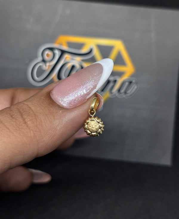 DIJE SOL 0,31D LARGO 1CM ANCHO 6MM NACÍ ORO 18KT