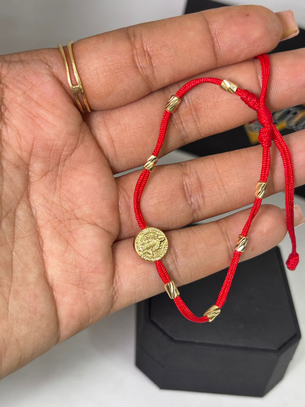 PULSERA TEJIDA 7 NUDOS CON SAN BENITO HILO ROJO 1,19GR NACI ORO 18KT