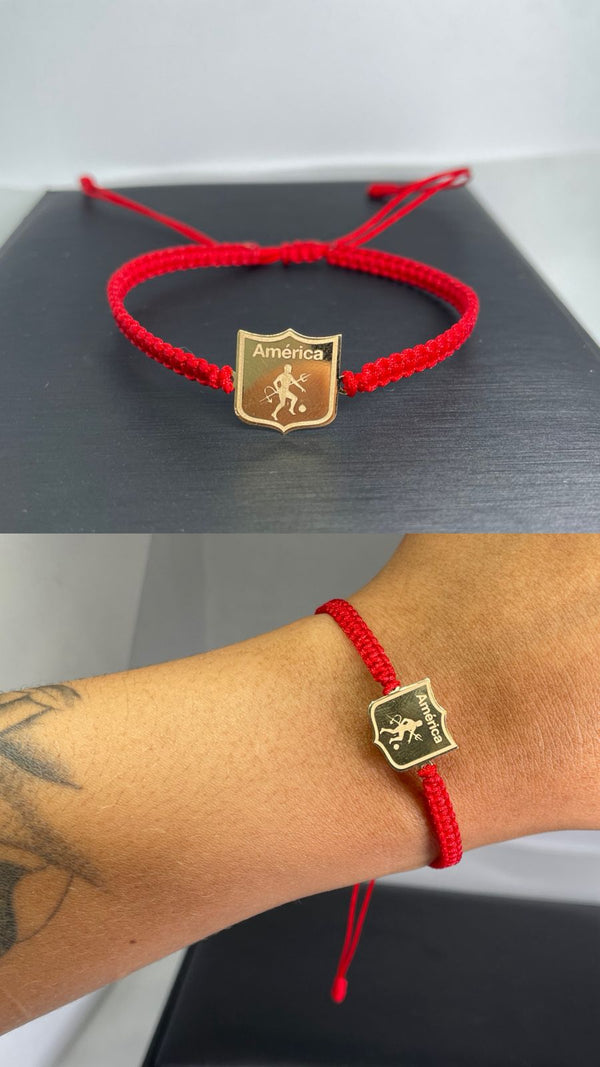 PULSERA ESCUDO AMÉRICA 0,59D LARGO 1,3CM ANCHO 1,2CM NACÍ ORO 18KT