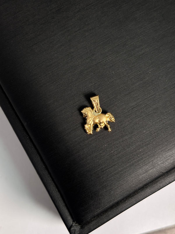 DIJE CABALLO 0,53D ALTO 1,4CM ANCHO 1CM NACI ORO 18KT