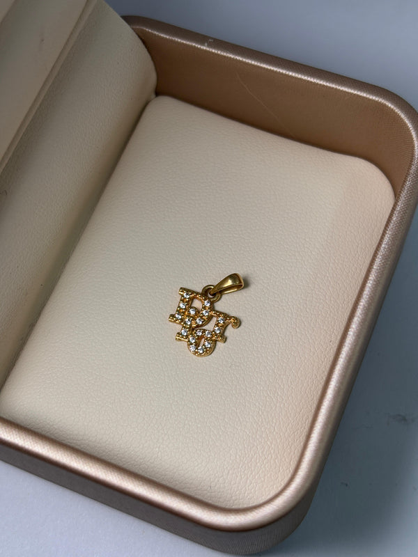 DIJE DR CIRCONES 1,20GR LARGO 1,5CM ANCHO 1CM NACI ORO 18KT