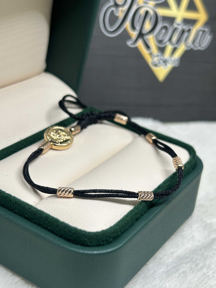 Pulsera 7 nudos san Miguel Oro18kt