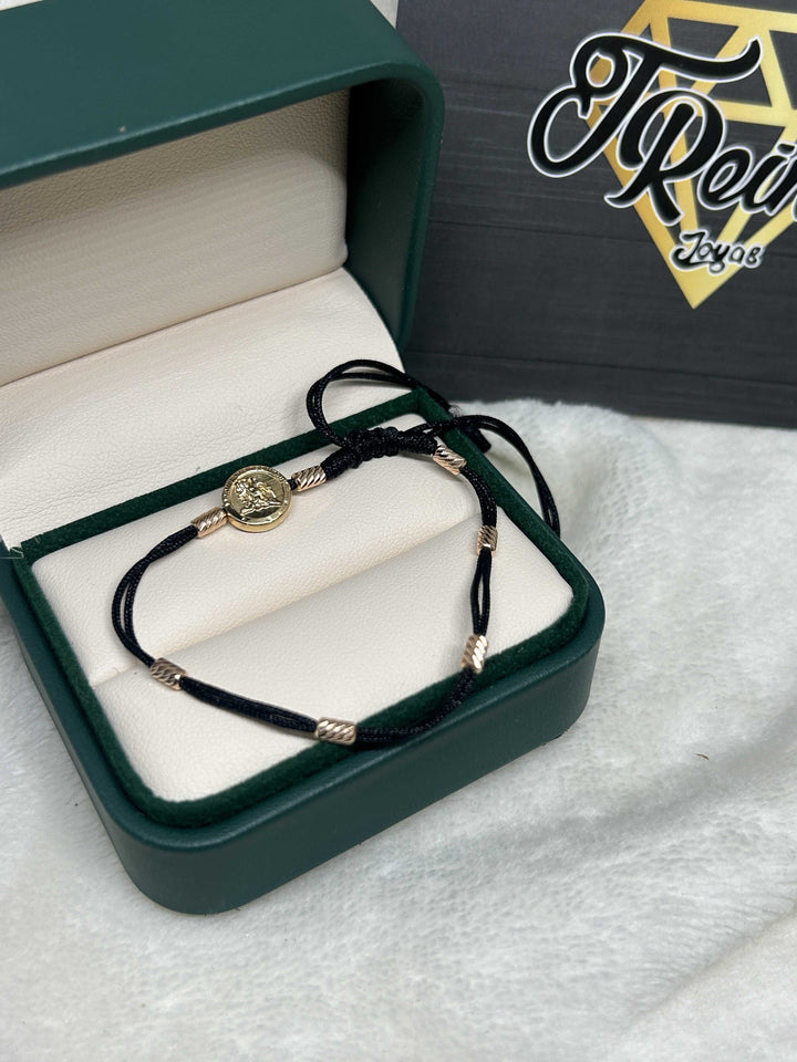 Pulsera 7 nudos san Miguel Oro18kt
