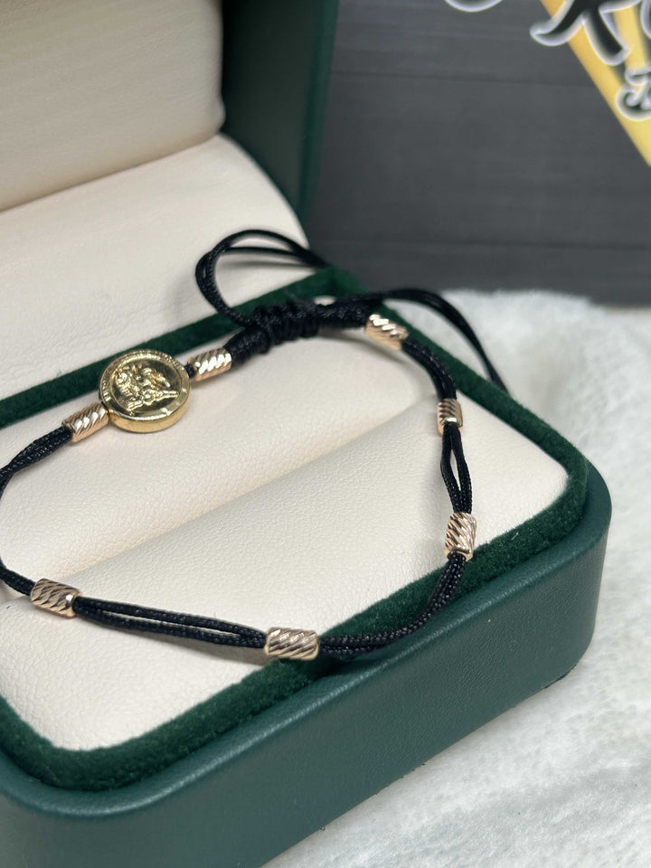 Pulsera 7 nudos san Miguel Oro18kt